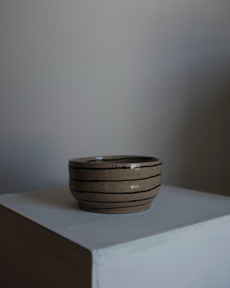 Spiral bowl — black and sand