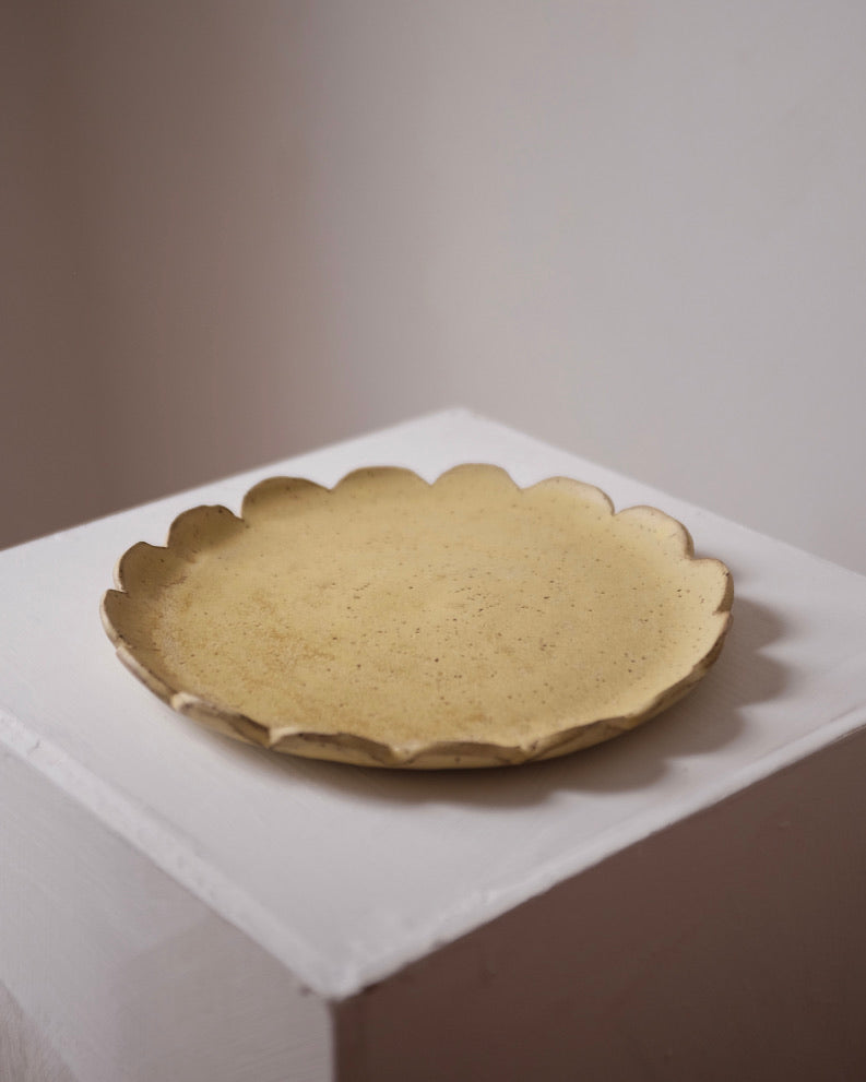 Large scalloped plate — speckled yellow