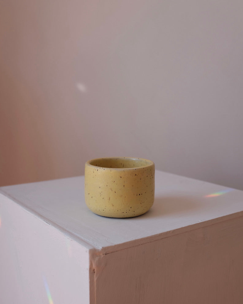 Cup — speckled yellow